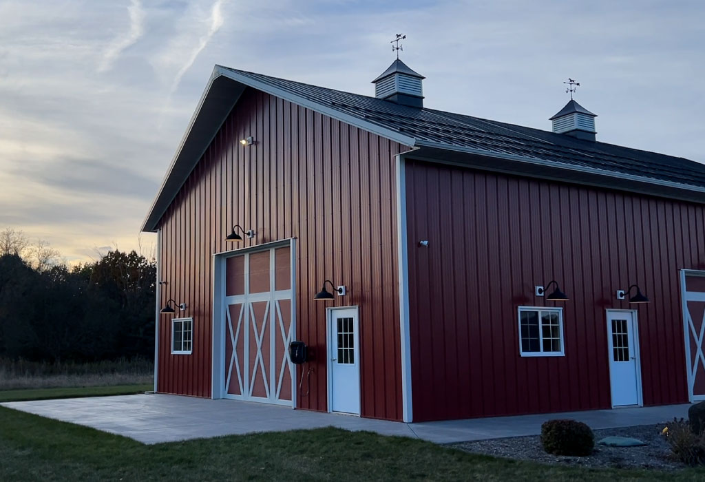 Custom Steel Building Construction and Design | Walters Buildings Custom steel building designed and constructed by Walters Buildings with overhead door, walk doors, and cupolas